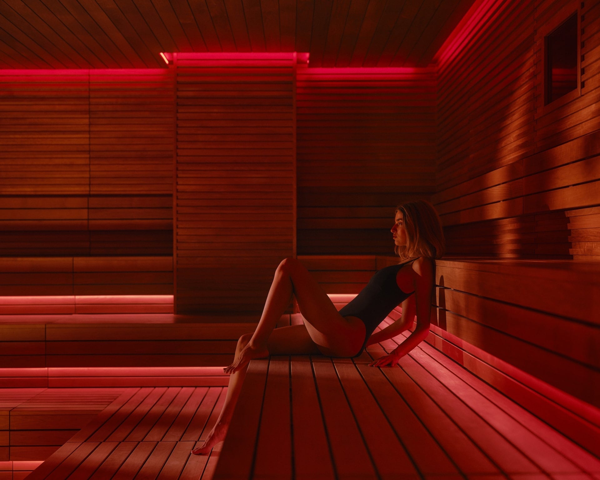 Woman sitting in a sauna